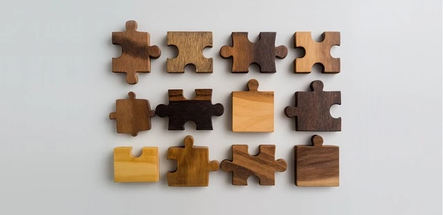 Problem solving cognitive assessment illustration representing a wooden jigsaw puzzle pieces arranged in neat rows on a light background, with one distinct piece in the center